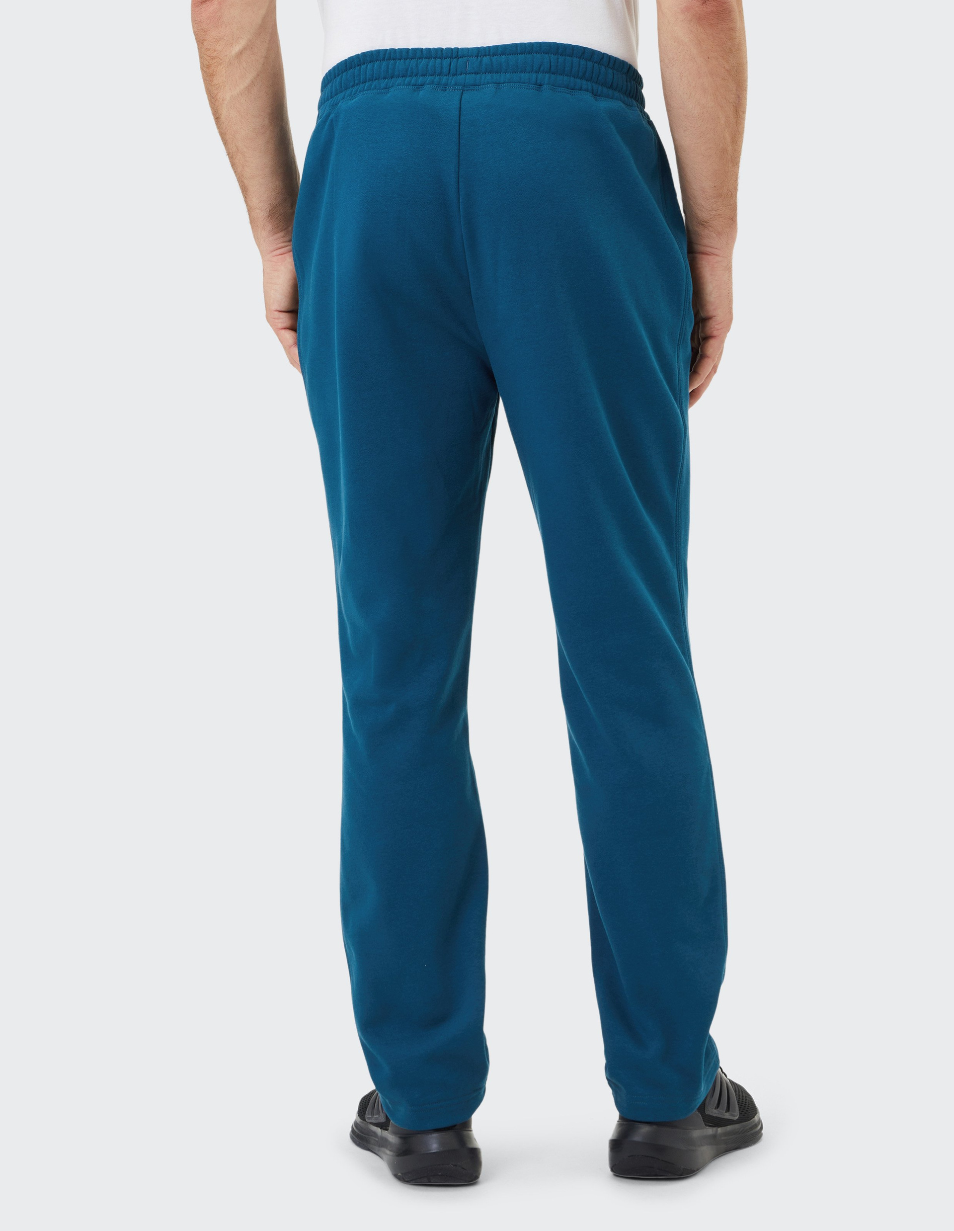 Dunkelblaue Jogginghose mit elastischem Bund, zwei seitlichen Reißverschlusstaschen und geradem Schnitt vor weißem Hintergrund.