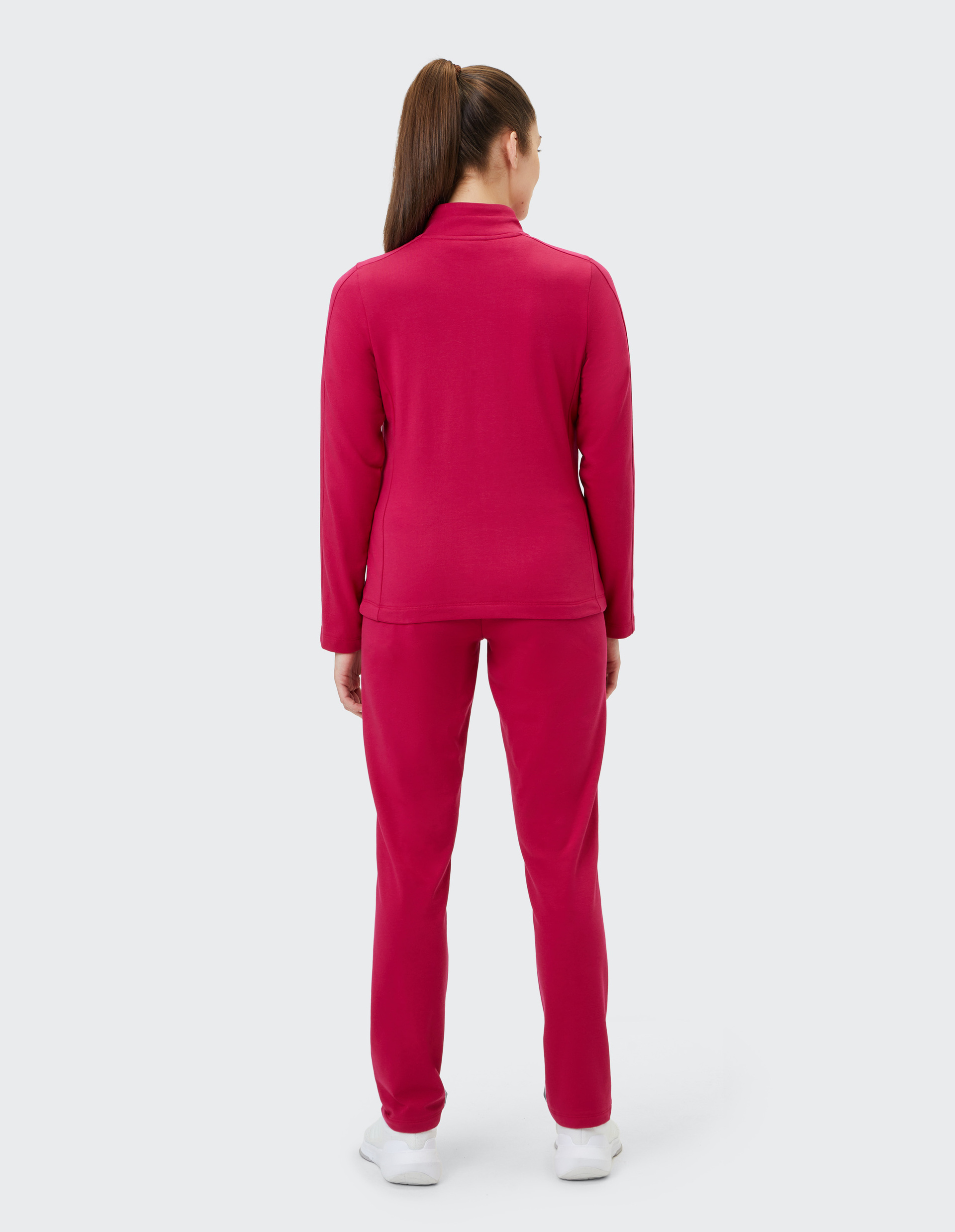 Roter Freizeitanzug mit langen Ärmeln und Reißverschluss an der Jacke, passende lange Hosen, bequemer und schlichter Stil.