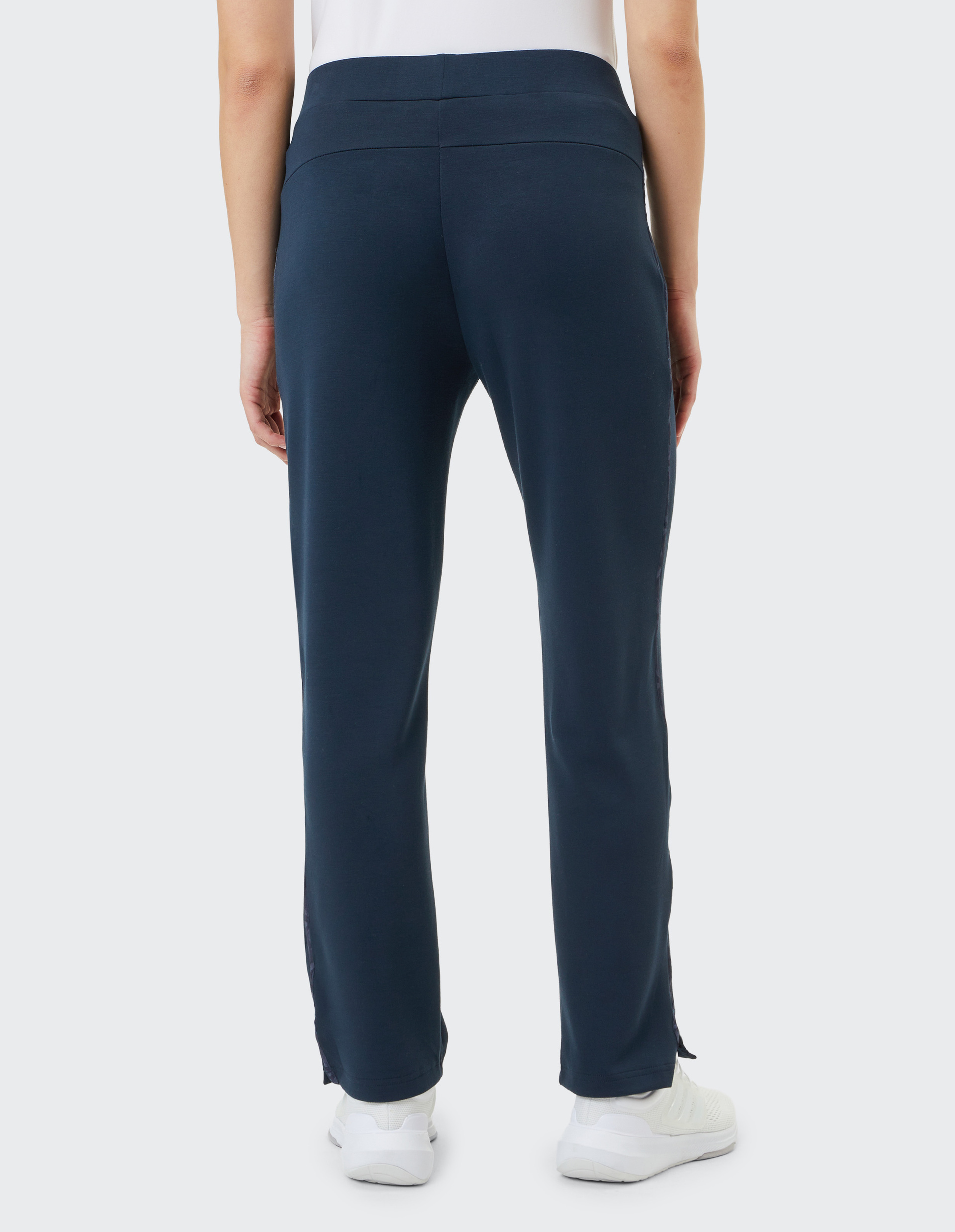 Dunkelblaue Jogginghose mit geradem Schnitt, elastischem Bund und Kordelzug, seitlichen Taschen mit Reißverschluss.